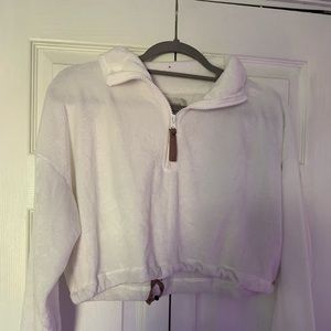 A cropped furry zip up from Urban Outfitters